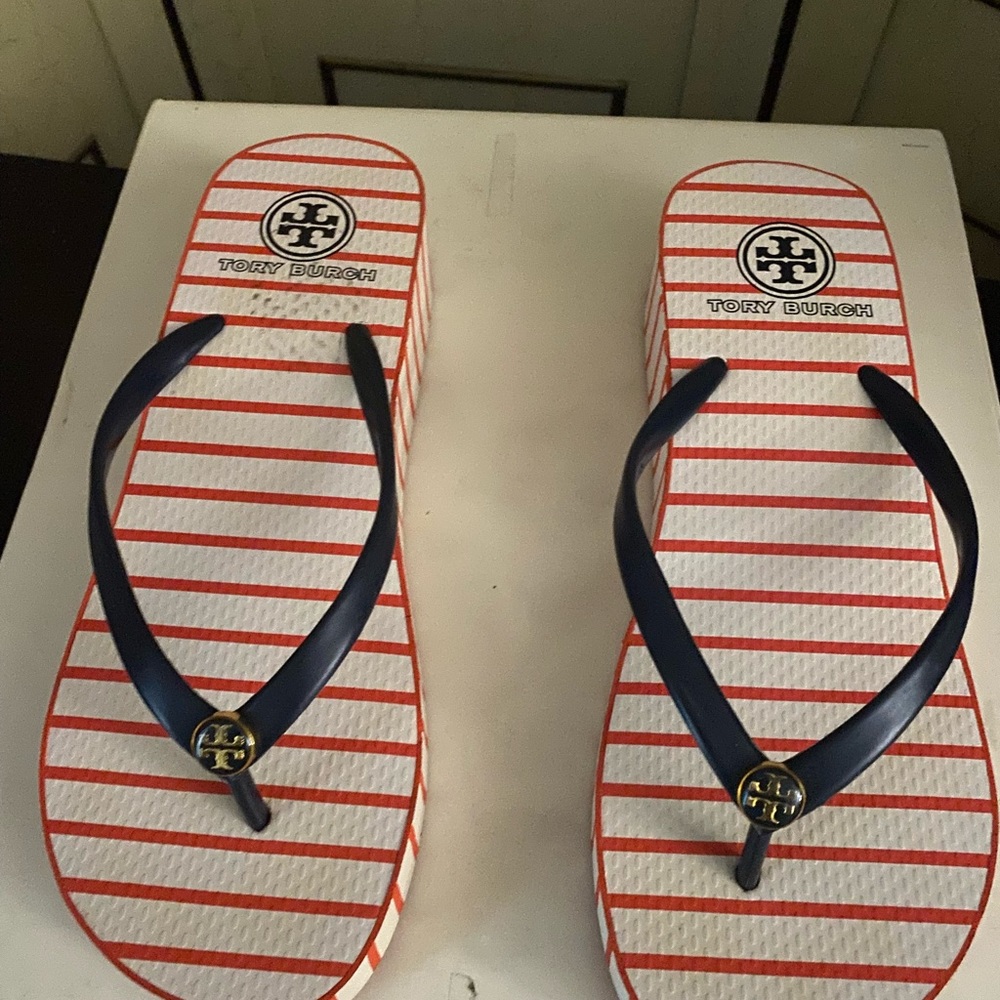 Tory Burch Thandie stripe wedge flip flops.